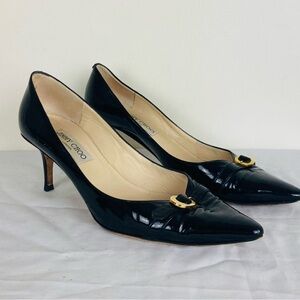 Jimmy Choo black patent leather “Jacob” pump with gold buckle. Size 39